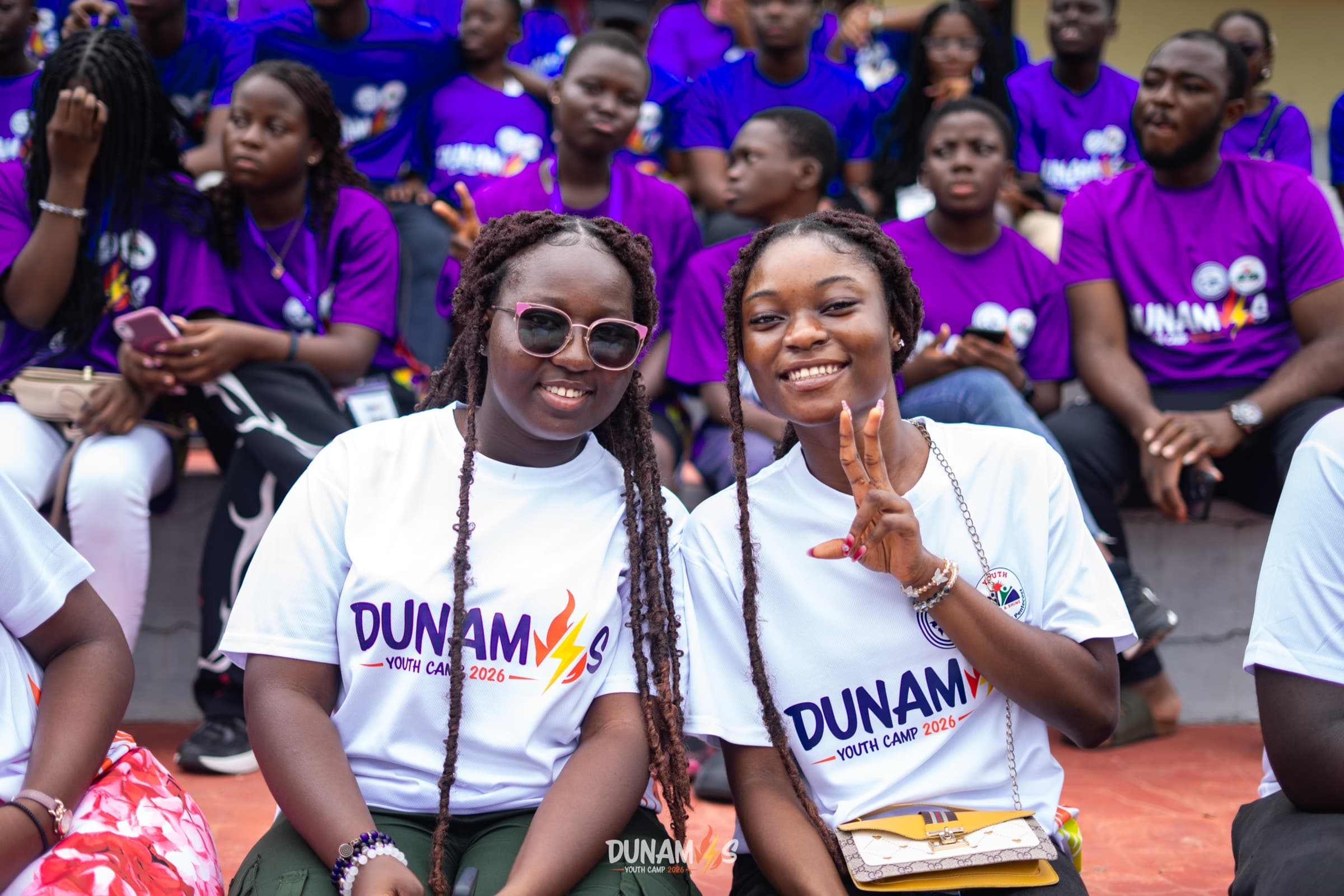 Two campers in Dunamis shirts smiling for the camera