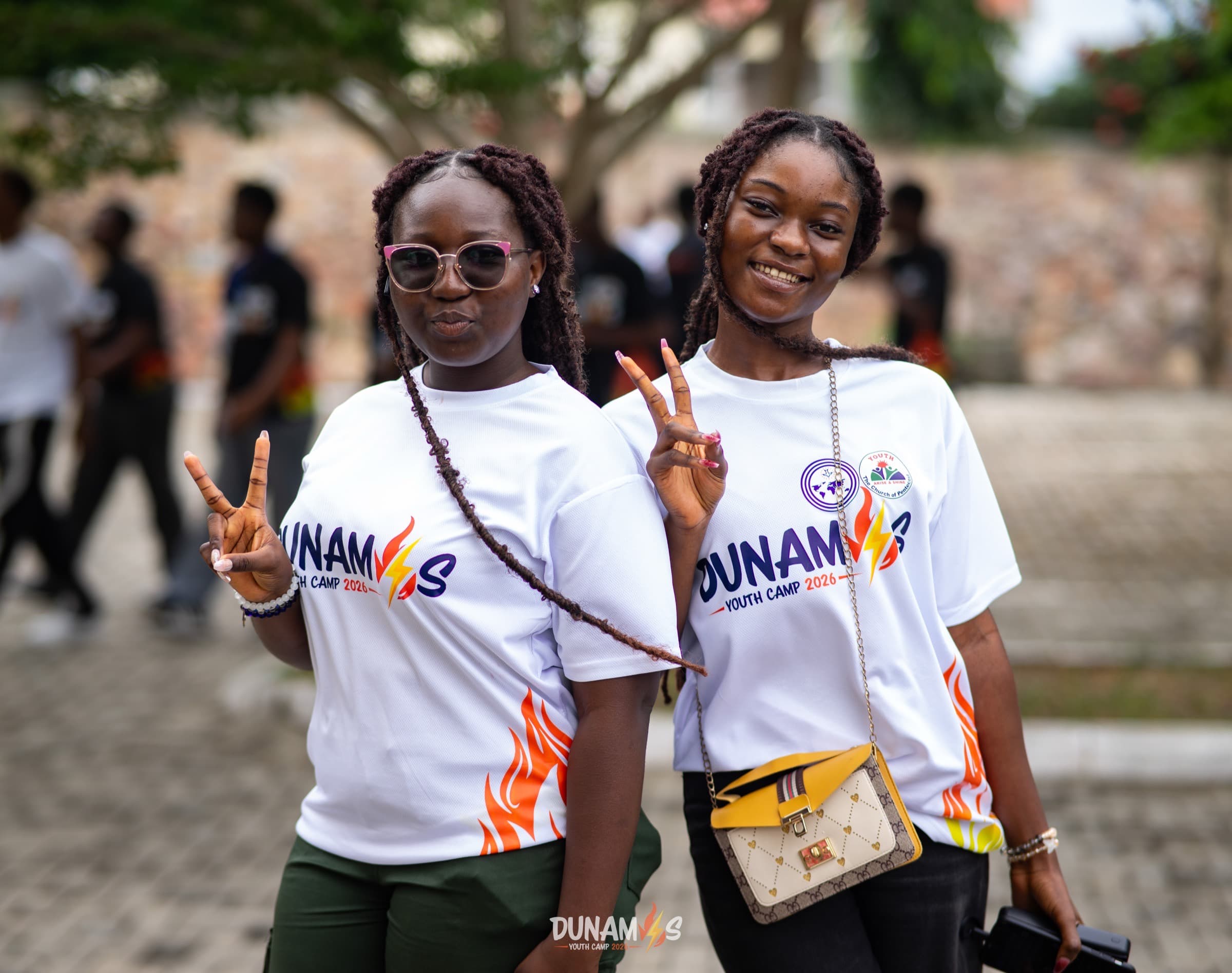 Campers in Dunamis camp shirts posing outdoors