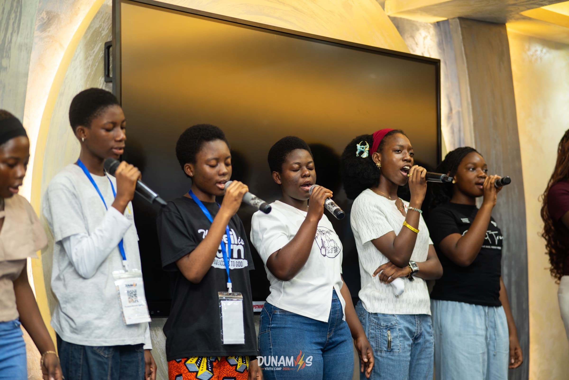 The worship team singing together on stage