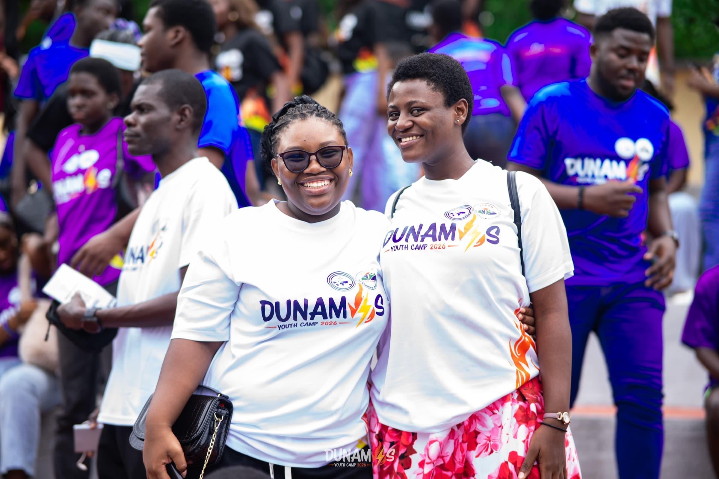Camp organisers and campers together in branded shirts